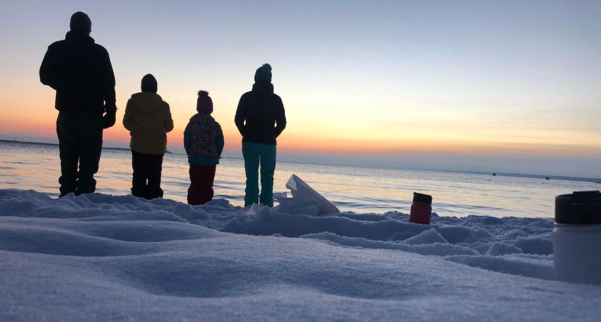 Renee and her family reflecting near Lake Superior